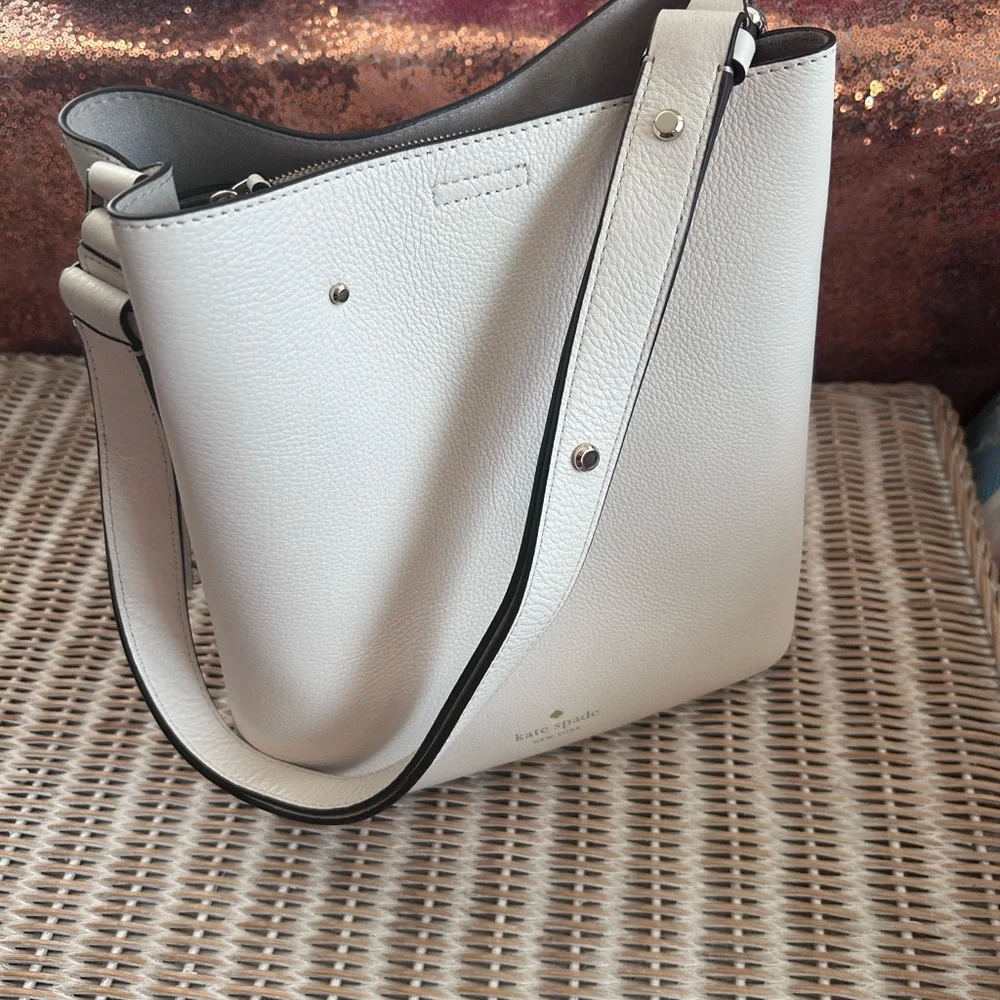 Kate Spade New York Marti large bucket bag in white pebbled leather.